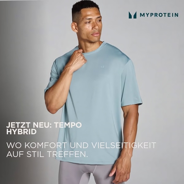 A high-quality studio portrait featuring a male model wearing a new blue performance t-shirt, emphasizing comfort and versatility.